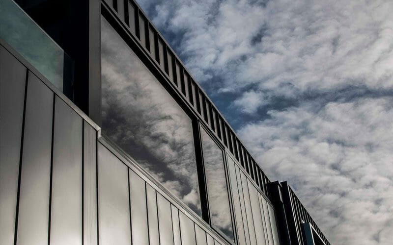 Interlocking and Standing Seam cladding in COLORBOND® Woodland Grey® and COLORBOND® Astro® at Peel Street Townhouses, Melb...