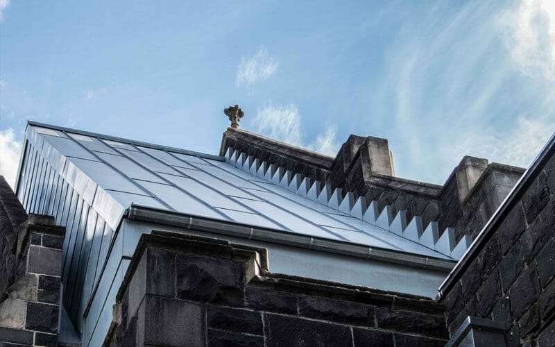Interlocking and Standing Seam cladding in Rheinzink Pre-weathered at Memorial Hall, Melbourne Grammar, Melbourne