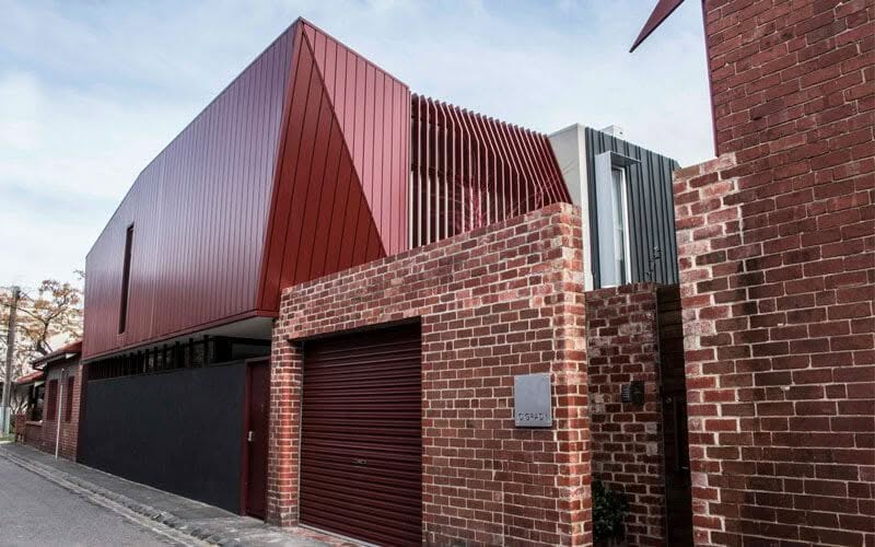 Interlocking cladding in COLORBOND® Manor Red® at O'Grady Street House, Melbourne